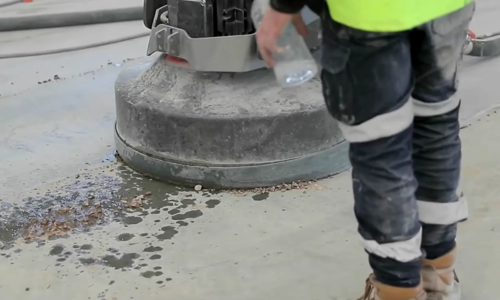 Grinder head working across a concrete slab