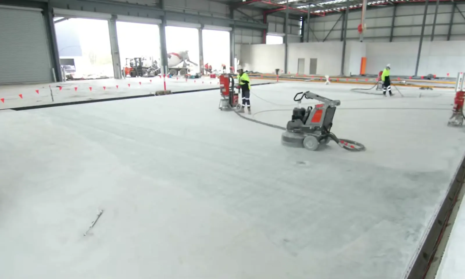 Large warehouse slab being prepared by several Apex crews